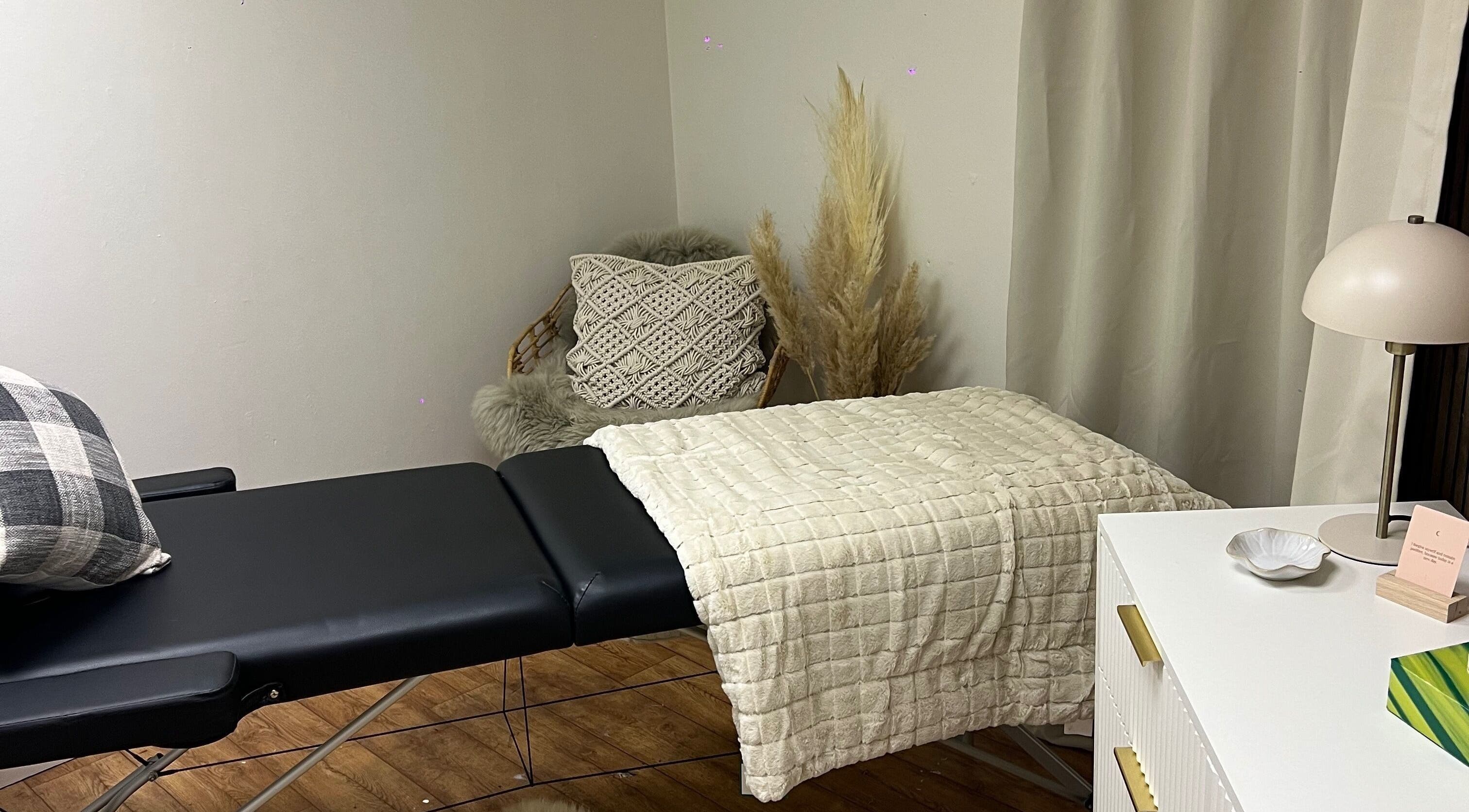 Relaxing treatment room at Blush & Arch, Bromyard, England, GB with a massage table and calming decor.