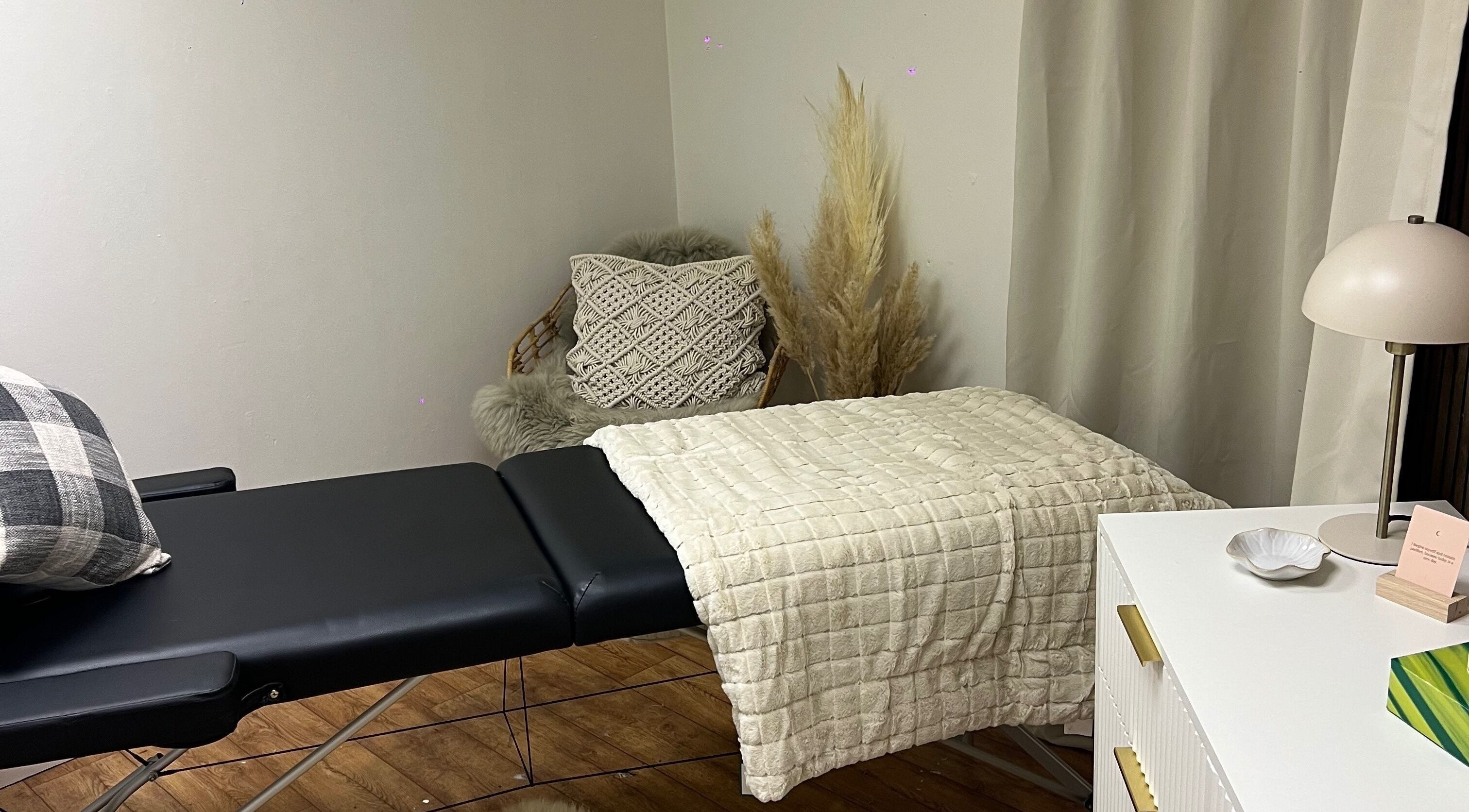 Relaxing treatment room at Blush & Arch, Bromyard, England, GB with a massage table and calming decor.