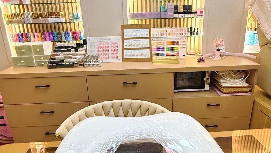Nail table setup at Yie Academy & Nail Studio in Bali, Bali, ID showcasing polish and tools.