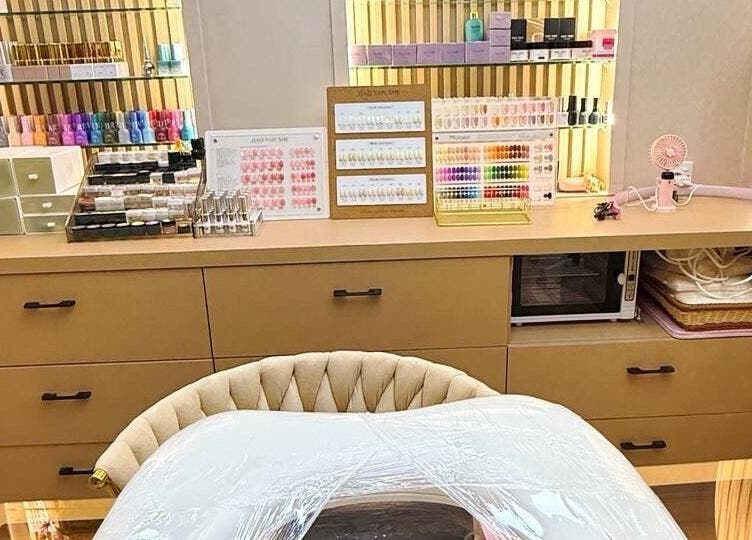 Nail table setup at Yie Academy & Nail Studio in Bali, Bali, ID showcasing polish and tools.