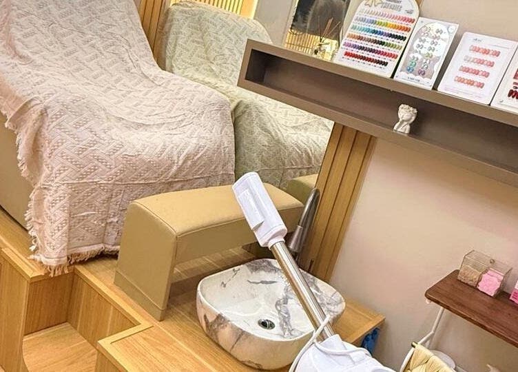 Luxurious nail care setup at Yie Academy & Nail Studio, Bali, Bali, ID featuring spa chair and nail polish options.