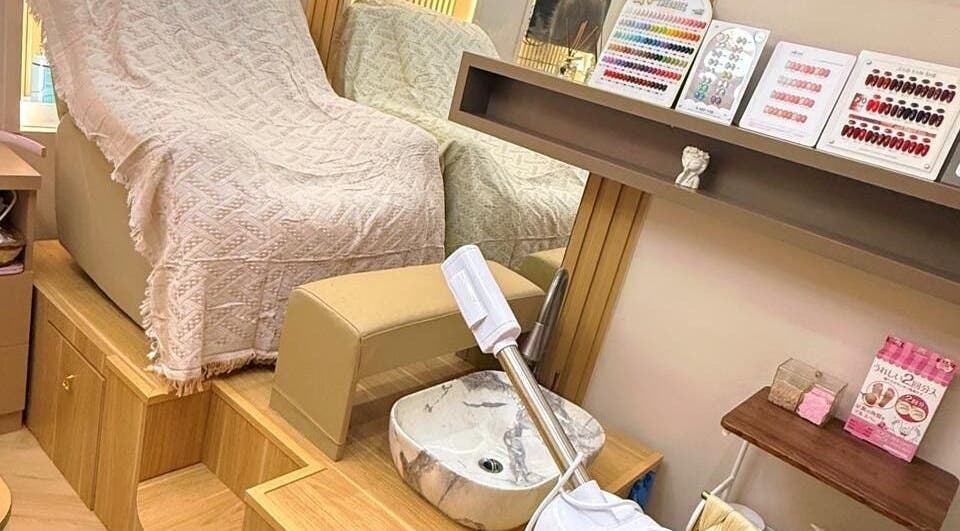 Luxurious nail care setup at Yie Academy & Nail Studio, Bali, Bali, ID featuring spa chair and nail polish options.