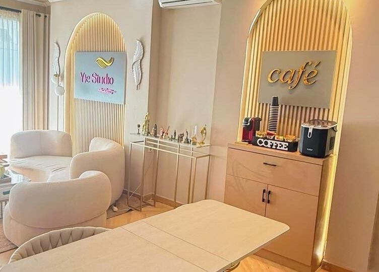 Inviting lounge at Yie Academy & Nail Studio, Bali, Bali ID with plush seating and café corner.