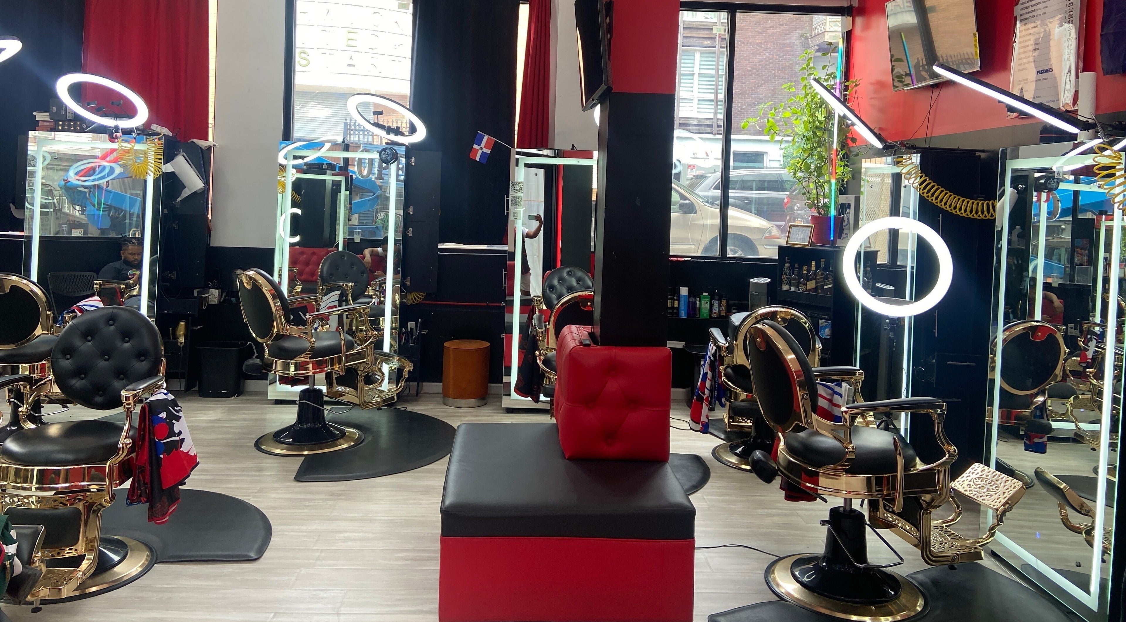 Elegant salon interior at Fade By Eraylin, New York, New York, US, with modern barber chairs and bright lighting.