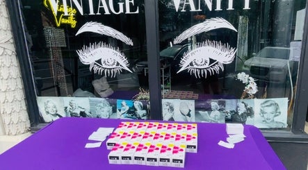 Front window display at Vintage Vanity in Shamokin, Pennsylvania, US, featuring retro decor and beauty products.