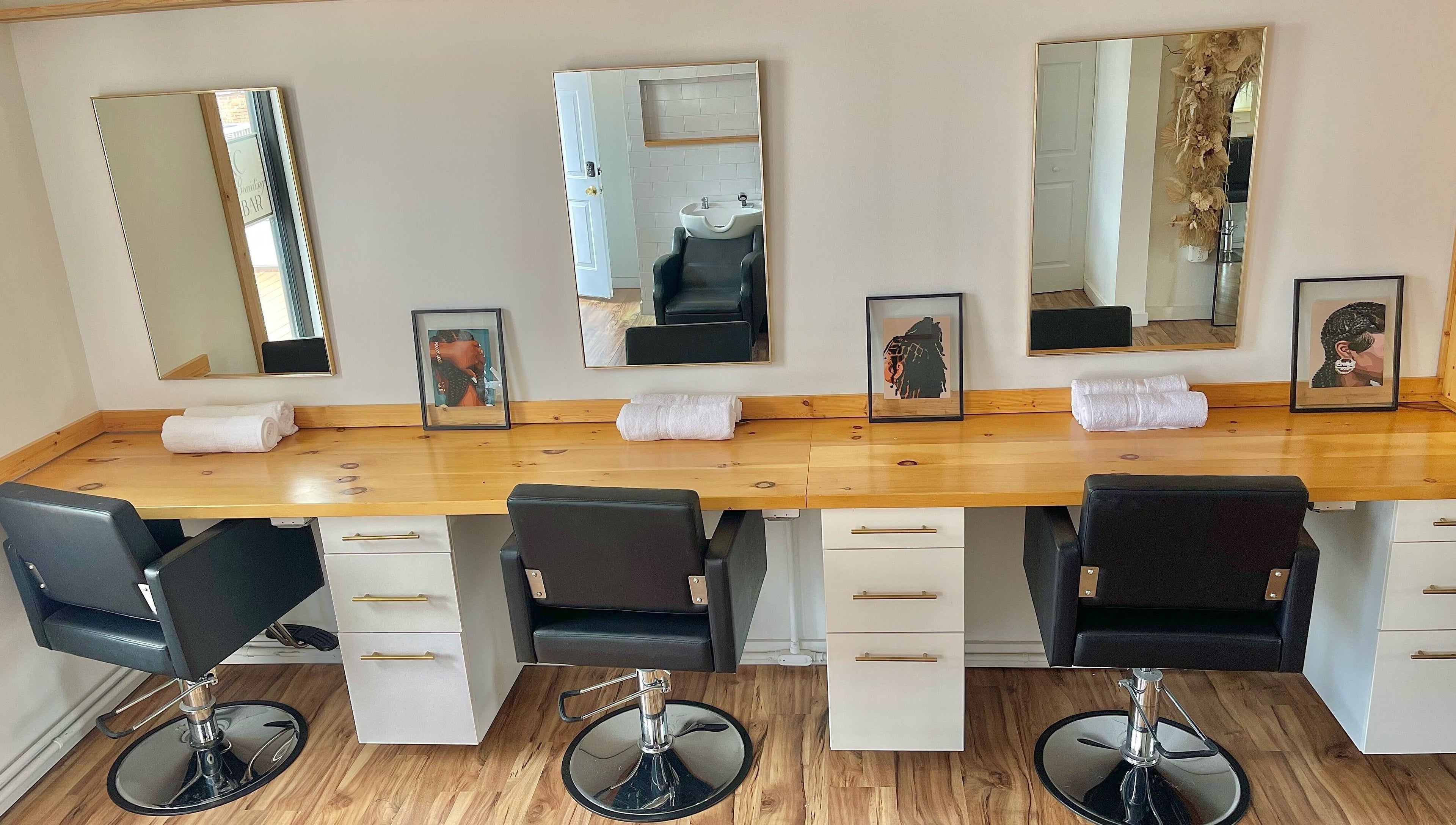 Elegant salon styling chairs and mirrors at KC Braiding Bar, Kansas City, Missouri, US.