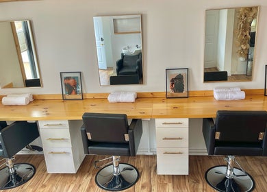 Elegant salon styling chairs and mirrors at KC Braiding Bar, Kansas City, Missouri, US.