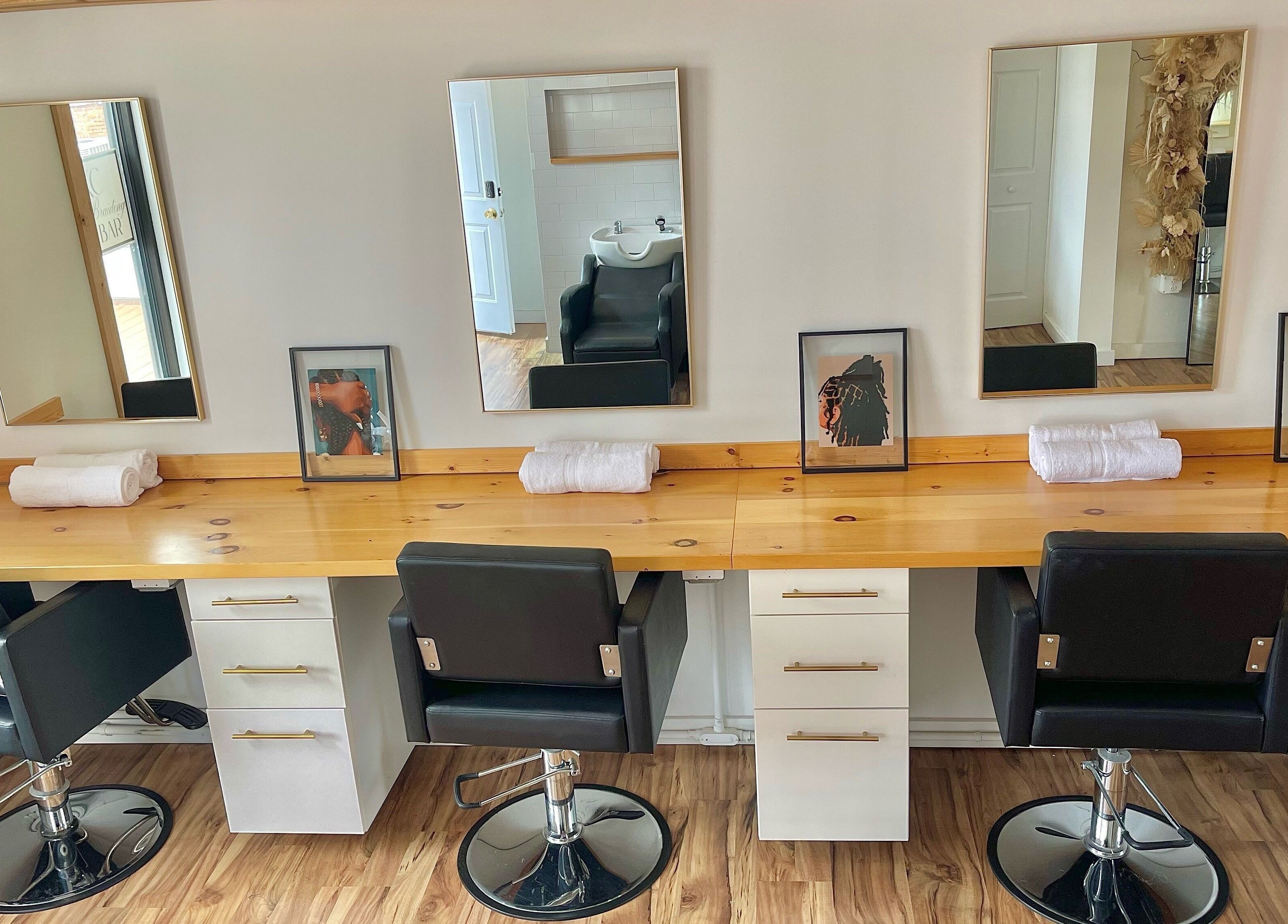 Elegant salon styling chairs and mirrors at KC Braiding Bar, Kansas City, Missouri, US.