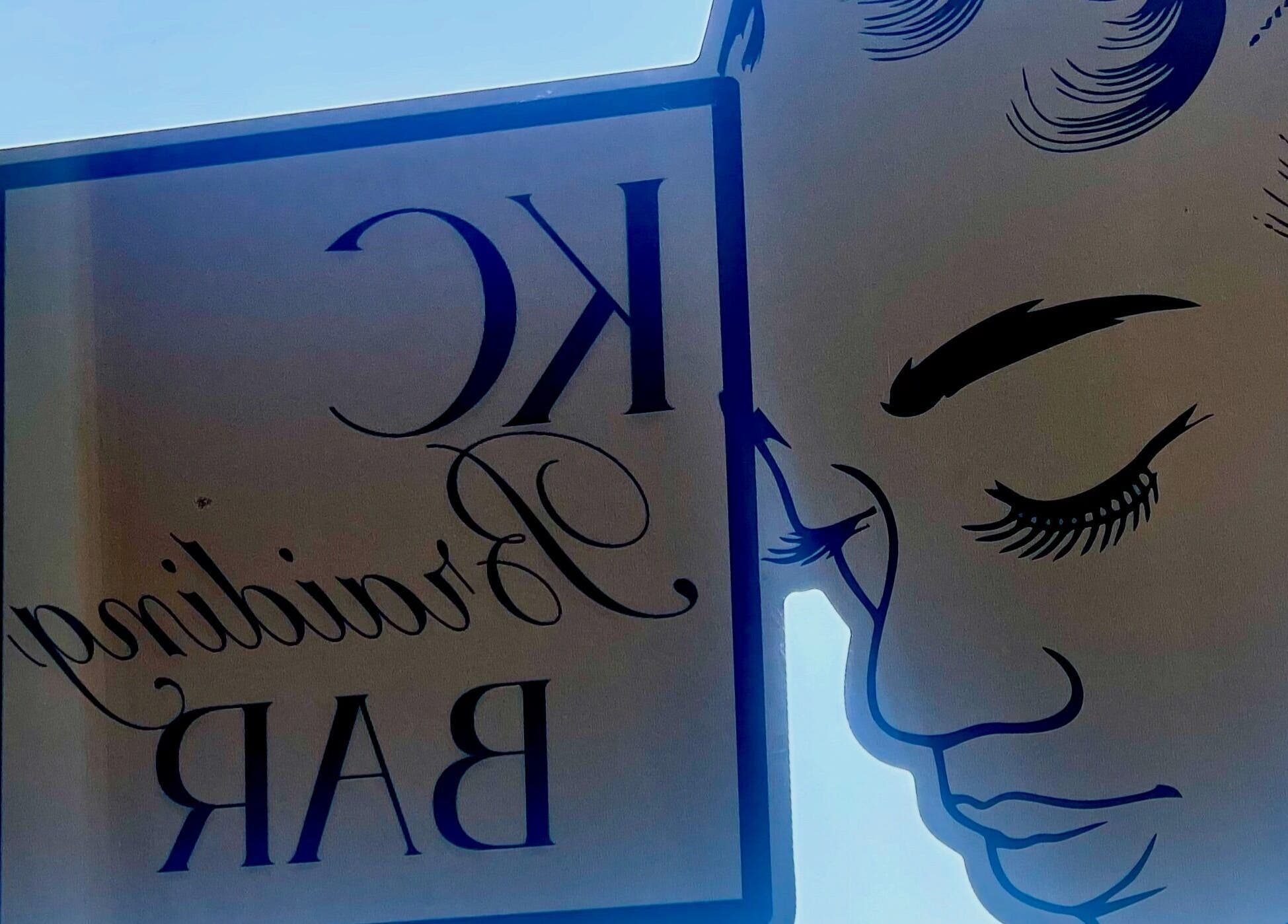 Elegant KC Braiding Bar logo and profile art viewed from inside in Kansas City, Missouri, US.