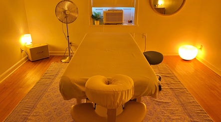 Cozy massage room at Zephyr Massage and Bodywork, North Little Rock, Arkansas, US, with calming lighting.