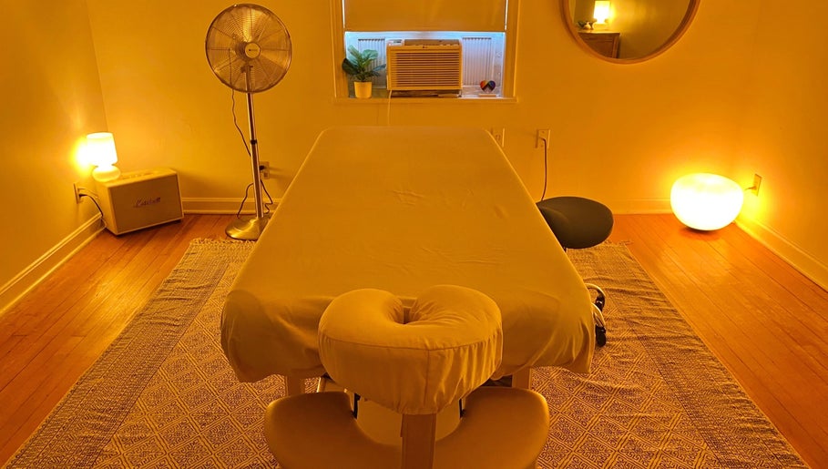 Peaceful massage room at Zephyr Massage and Bodywork in North Little Rock, Arkansas, US with warm lighting.