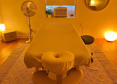 Peaceful massage room at Zephyr Massage and Bodywork in North Little Rock, Arkansas, US with warm lighting.