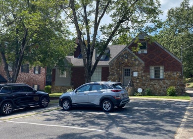 Exterior of Zephyr Massage and Bodywork in North Little Rock, Arkansas, US, surrounded by greenery.