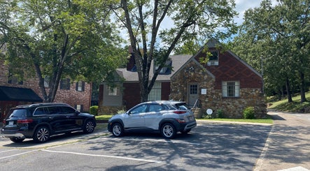 Exterior of Zephyr Massage and Bodywork in North Little Rock, Arkansas, US, surrounded by greenery.