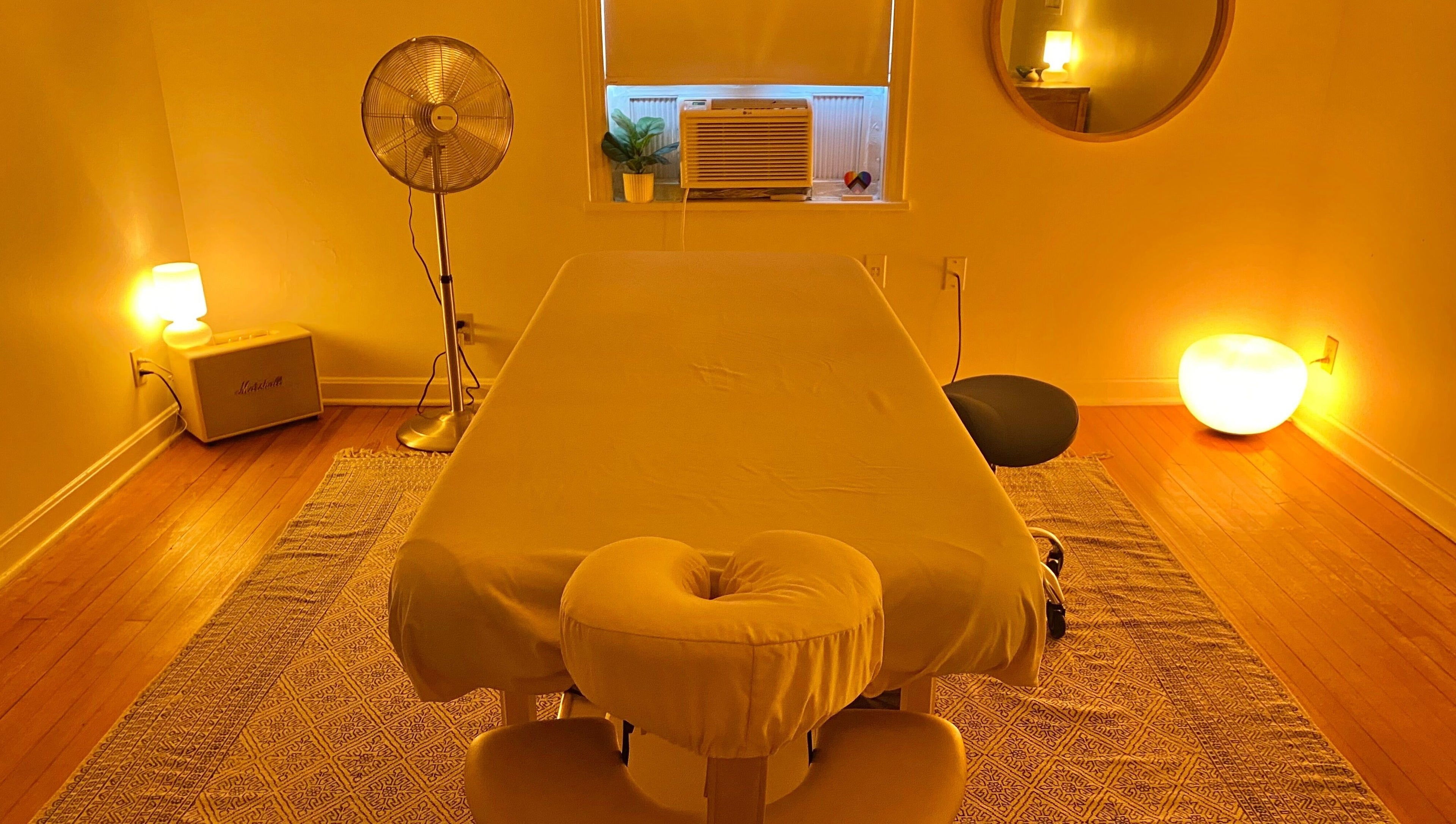 Cozy massage room at Zephyr Massage and Bodywork, North Little Rock, Arkansas, US with soft lighting.