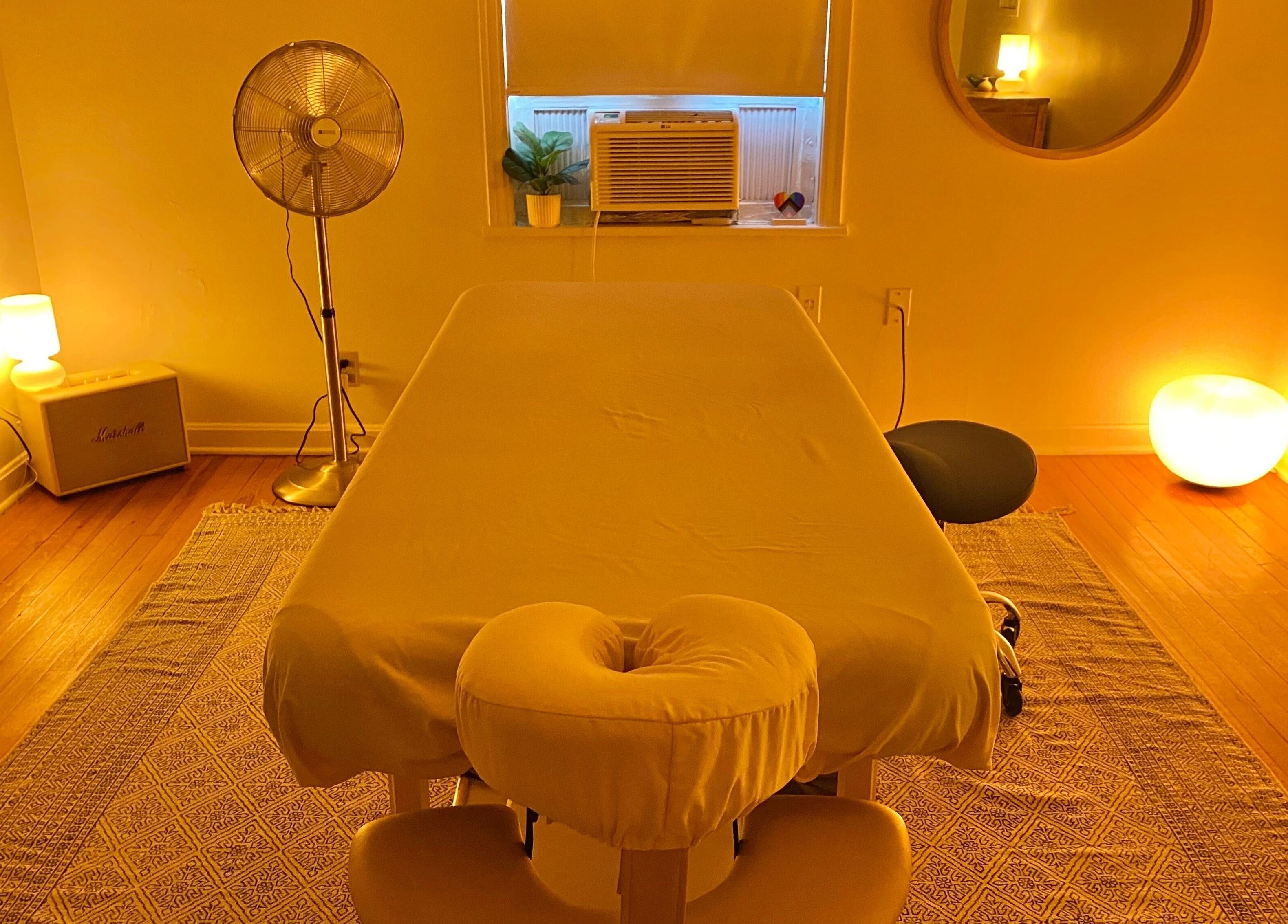 Cozy massage room at Zephyr Massage and Bodywork, North Little Rock, Arkansas, US with soft lighting.