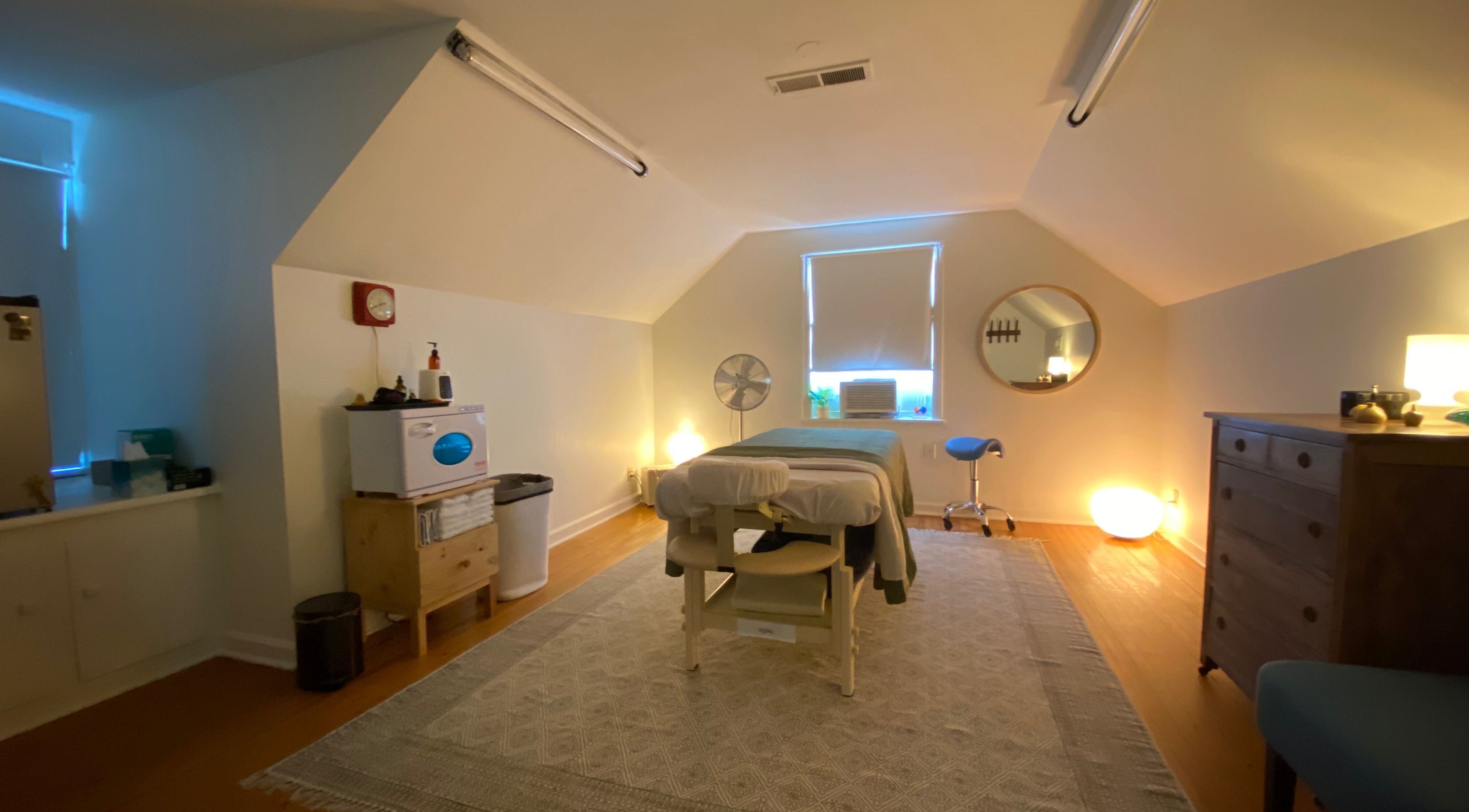 Cozy massage room at Zephyr Massage and Bodywork, North Little Rock, Arkansas, US with ambient lighting.