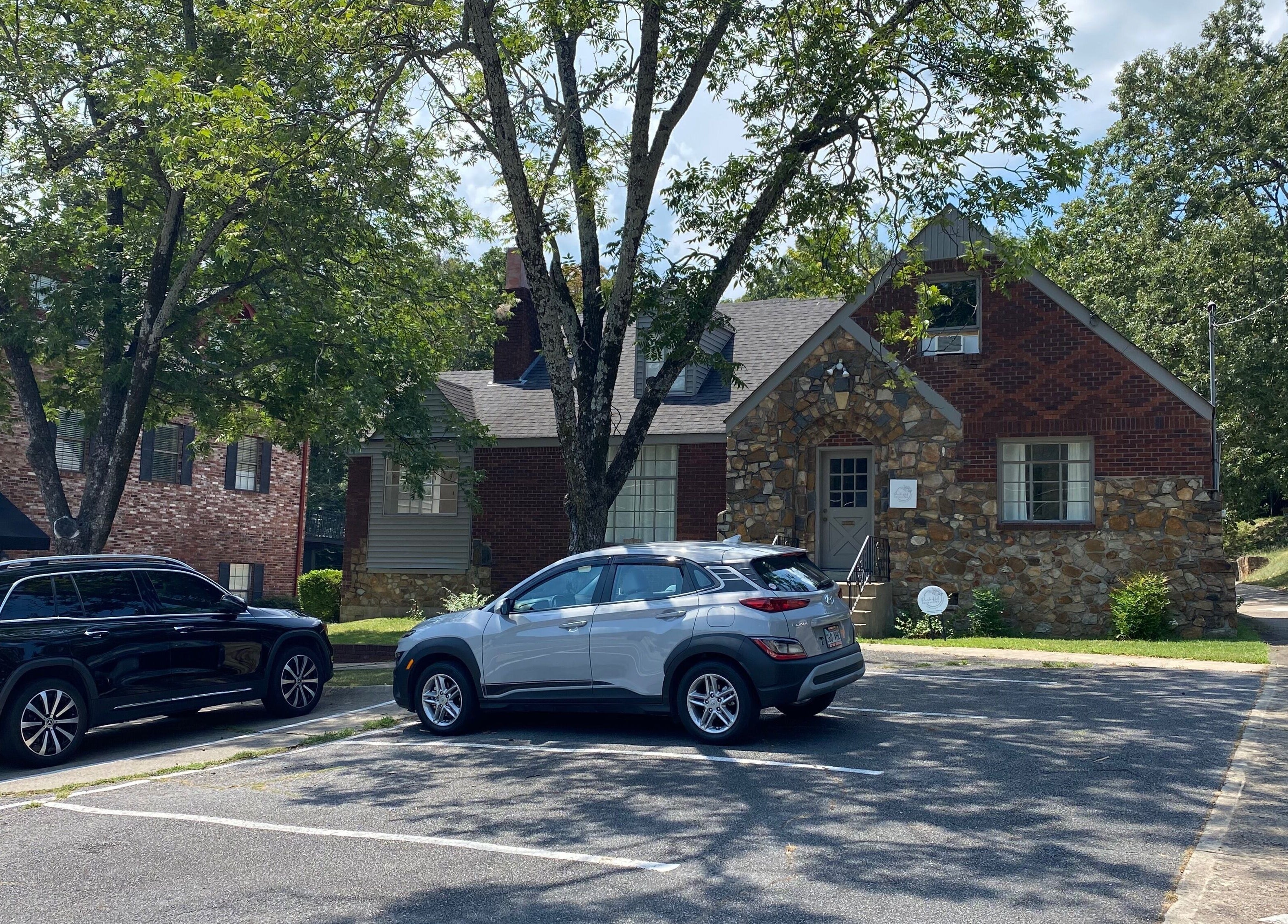 Exterior view of Zephyr Massage and Bodywork at North Little Rock, Arkansas, US, showcasing rustic architecture.