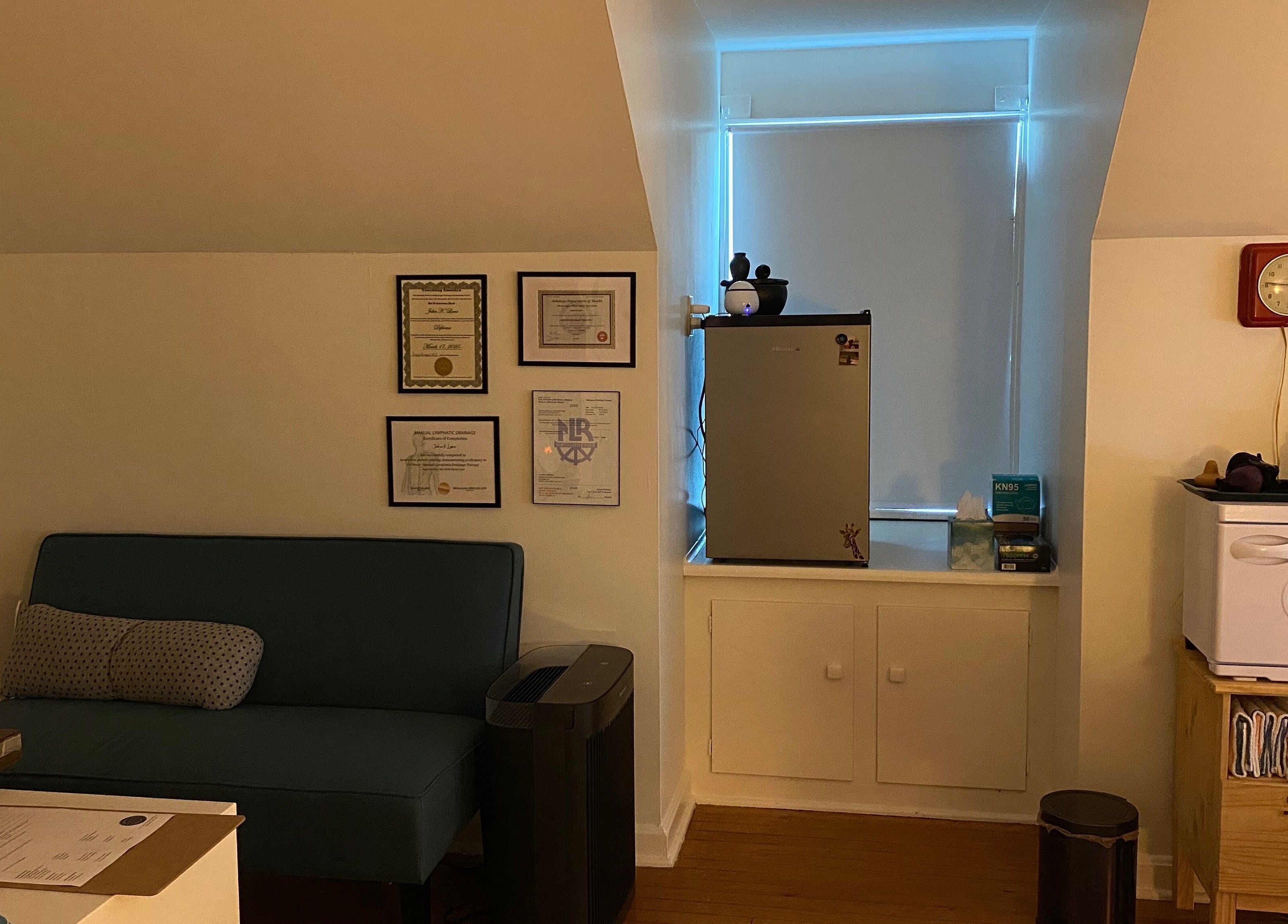 Cozy waiting area with certifications at Zephyr Massage and Bodywork, North Little Rock, Arkansas, US.