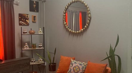 Stylish spa interior at Follicles Laser Aesthetic Spa, Castries, LC, featuring a mirror and vibrant decor.