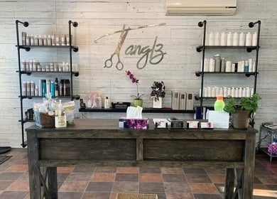 Reception area of Black Diamond Hair Salon in Churchbridge, Saskatchewan, CA showcasing product shelves and decor.