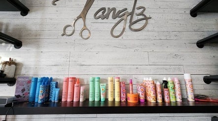 Variety of hair care products at Black Diamond Hair Salon, Churchbridge, Saskatchewan, CA, on a stylish shelf.