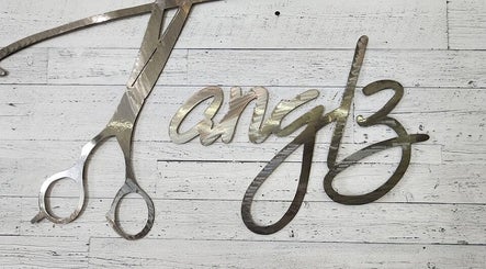 Metal scissors and script art at Black Diamond Hair Salon, Churchbridge, Saskatchewan, CA.