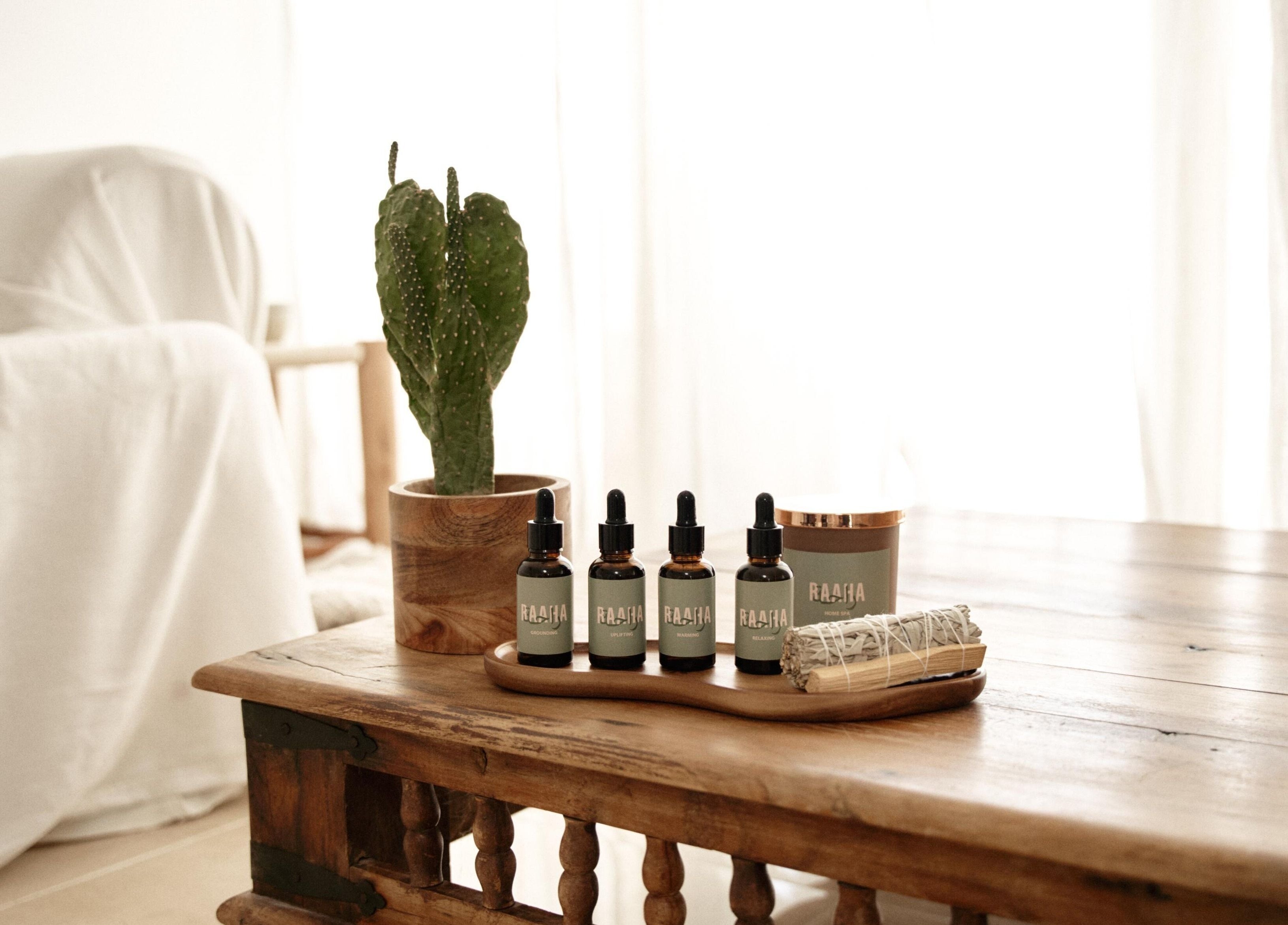 Raaha Wellness - Home Service's natural oils on a wooden table in Dubai, AE with a cozy, relaxing ambiance.