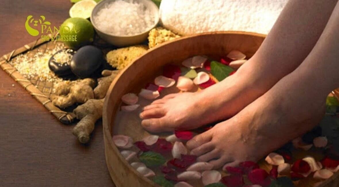 Relaxing foot soak with petals at Restore2Nature Massages, Birmingham, England, GB, promoting tranquility.
