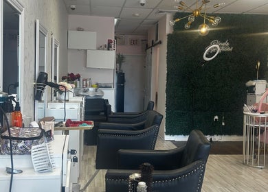 Elegant interior of Estella Dominican Hair Salon in Greenacres, Florida, US with stylish chairs and decor.