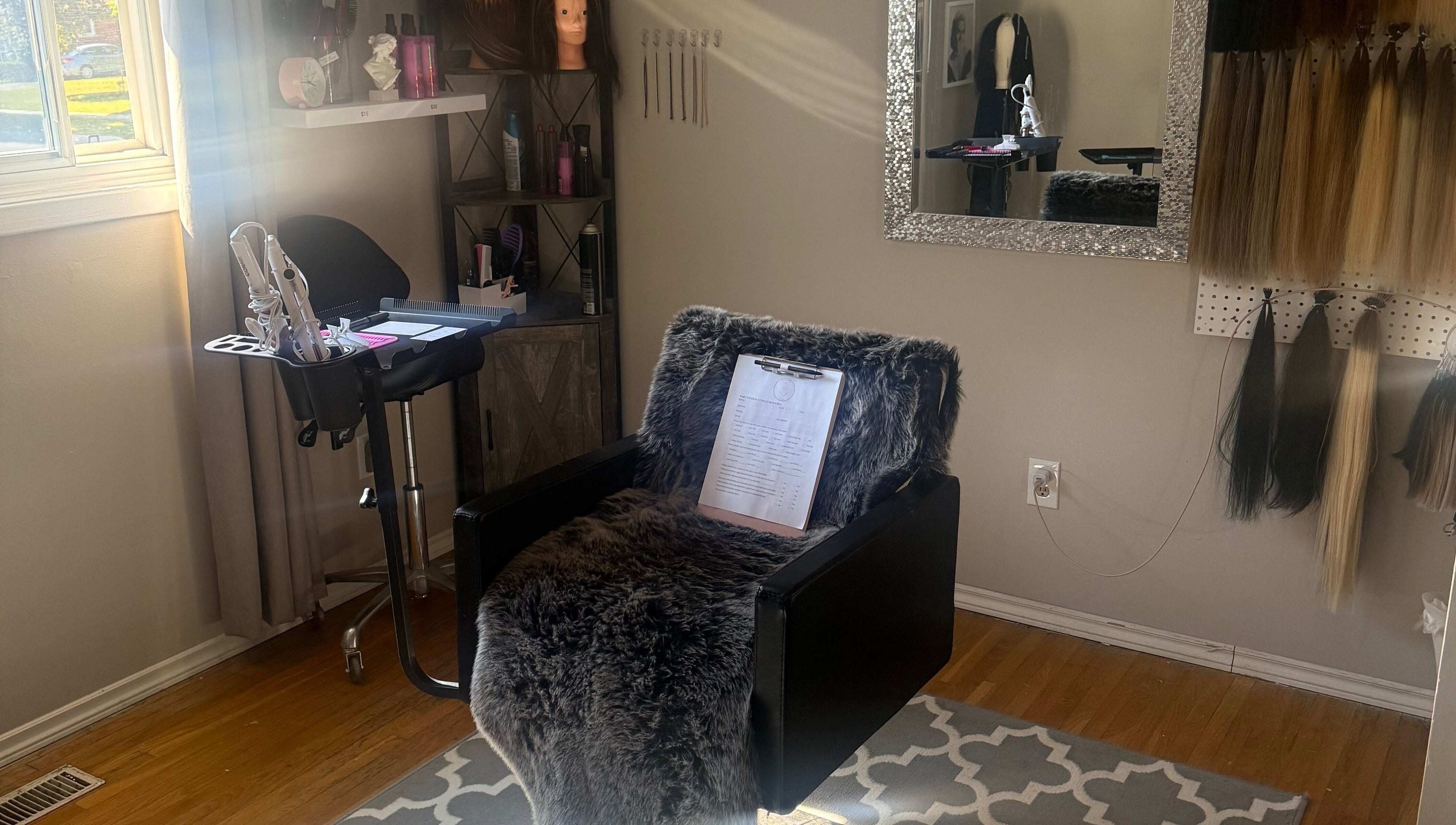 Cozy salon setup at Nano extensions by Chantelle, London, Ontario, CA with styling tools and hair samples.
