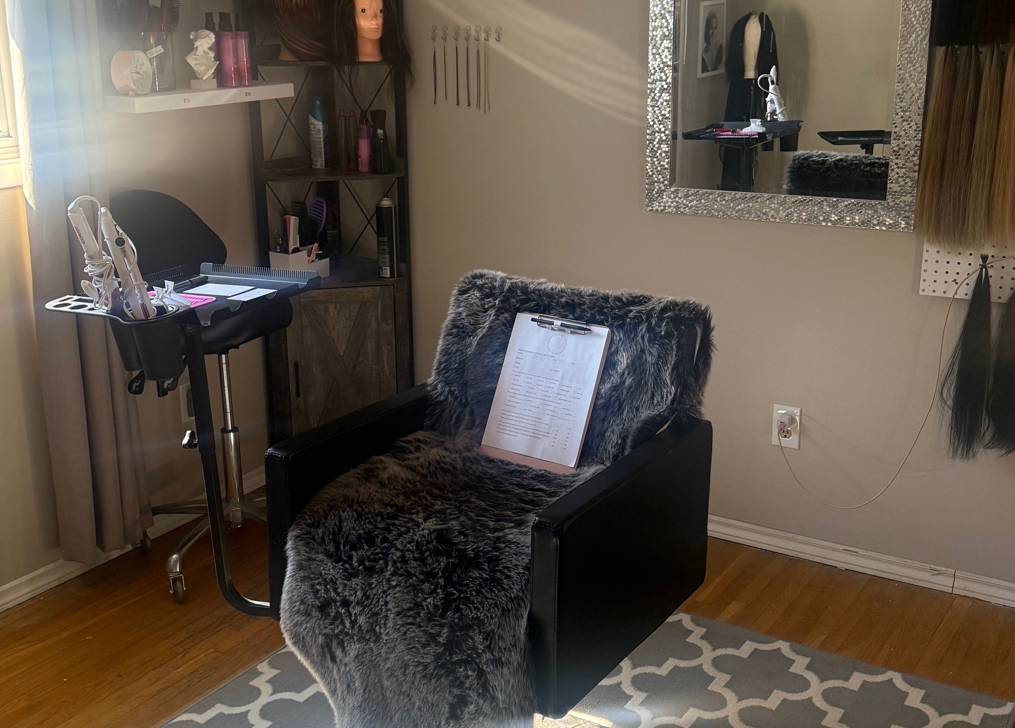 Cozy salon setup at Nano extensions by Chantelle, London, Ontario, CA with styling tools and hair samples.