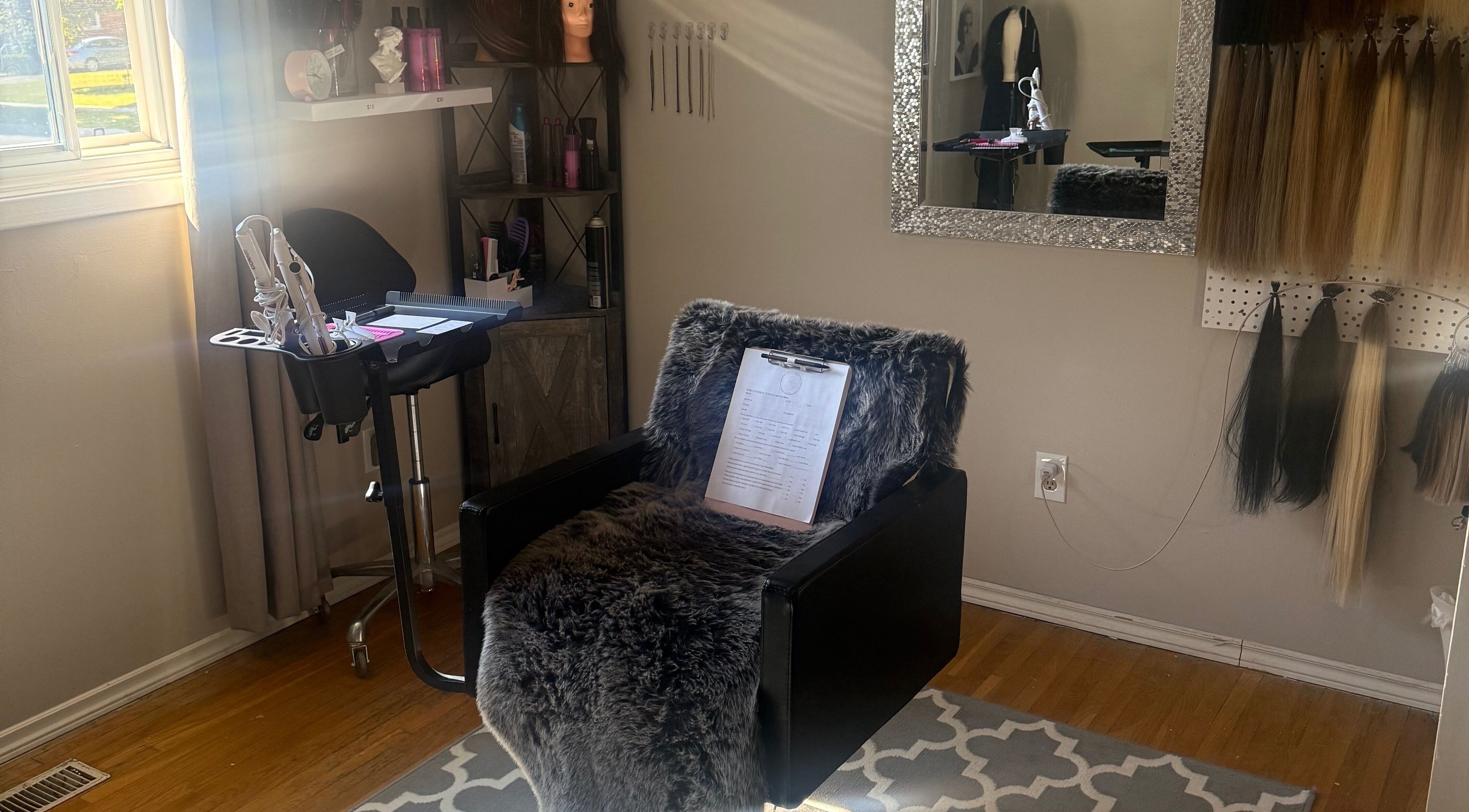 Cozy salon setup at Nano extensions by Chantelle, London, Ontario, CA with styling tools and hair samples.