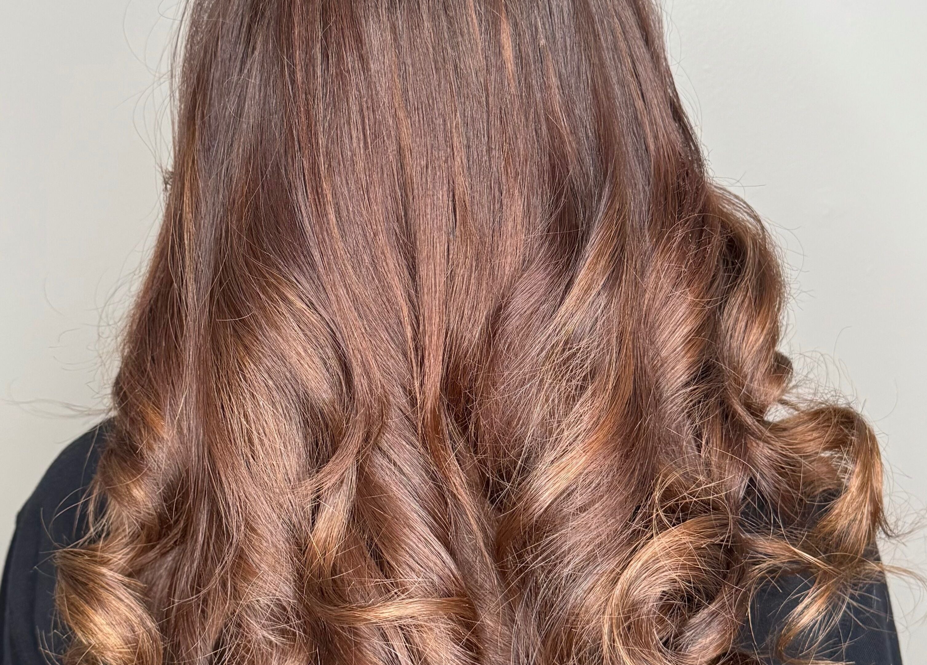 Lustrous brown curls styled at Nano extensions by Chantelle, located in London, Ontario, CA.