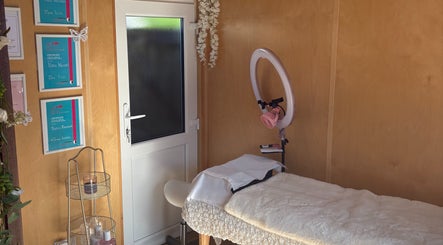 Inviting therapy room at Bezz Beauty in Barnet, England, GB featuring a plush massage table.