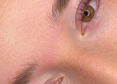 Close-up of an eye and eyebrow at Beauty with CS, Enfield, England, GB, showcasing flawless skin texture.