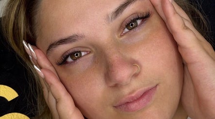 Close-up of a woman's face with radiant skin at Beauty with CS, Enfield, England, GB.