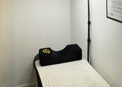 Eyelash extension bed at Beauty with CS, London, GB, featuring a signature black pillow.