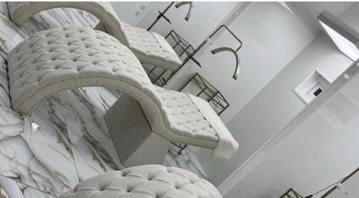 Elegant treatment beds at Advanced Aesthetics by Nikola in Leeds, England, GB, featuring plush decor.