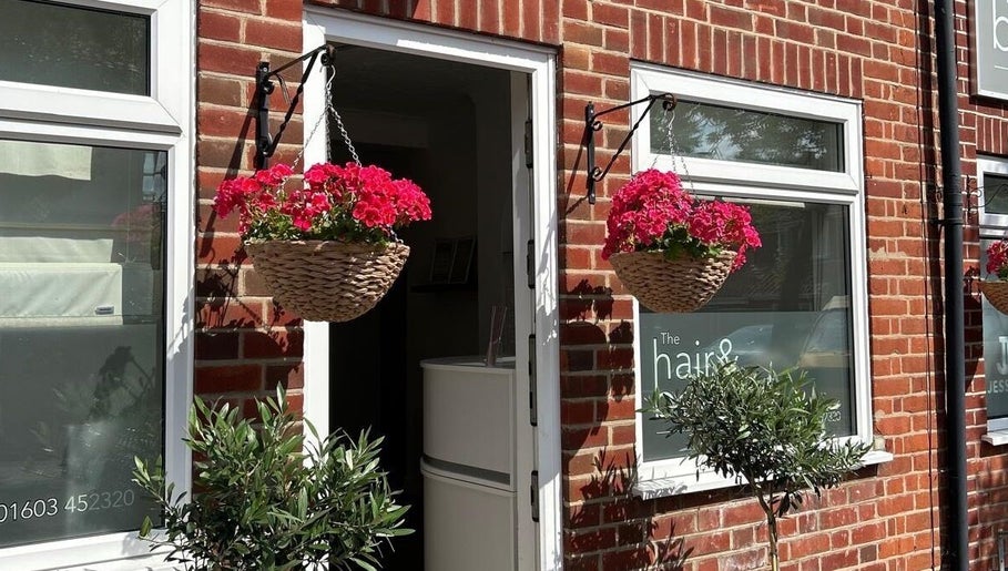 Welcoming front of Reflexology and Scar Release by Nadine in Norwich, England, GB with hanging flowers.