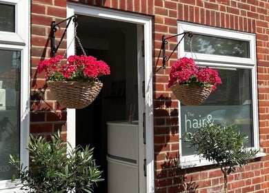 Welcoming front of Reflexology and Scar Release by Nadine in Norwich, England, GB with hanging flowers.