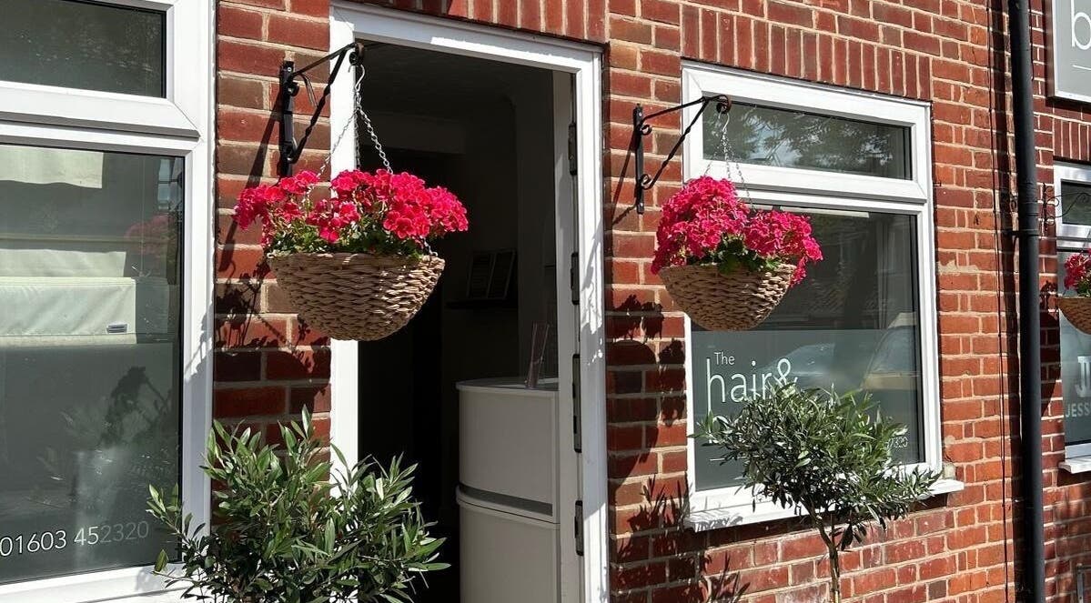 Welcoming front of Reflexology and Scar Release by Nadine in Norwich, England, GB with hanging flowers.