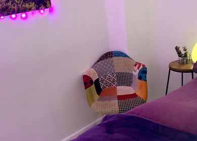 Colorful chair and ambient lighting at Reflexology and Scar Release by Nadine, Norwich, England, GB.