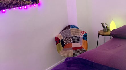 Colorful chair and ambient lighting at Reflexology and Scar Release by Nadine, Norwich, England, GB.