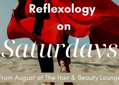 Reflexology session by Nadine in Norwich, England featuring a red dress on sand.