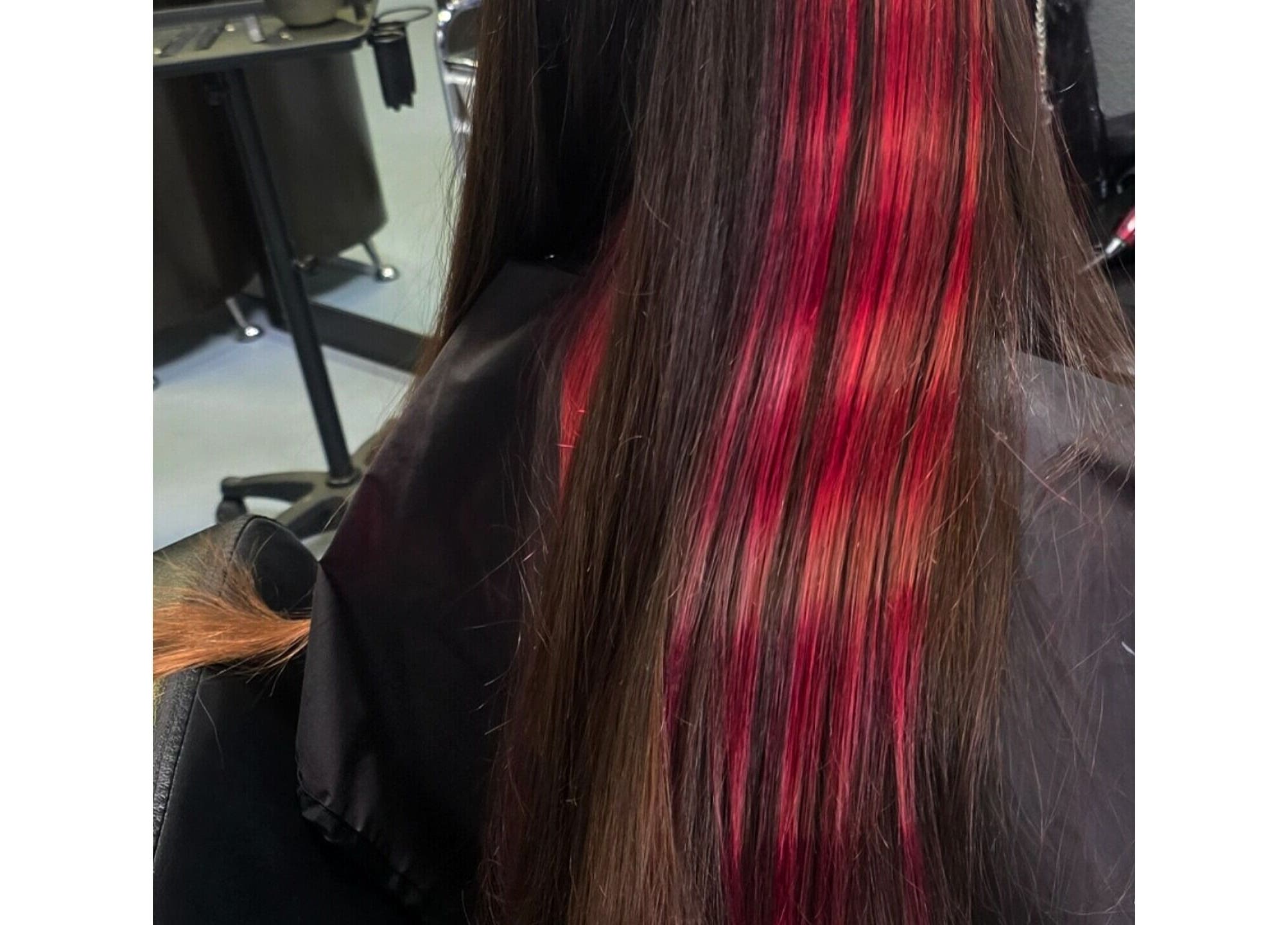 Red-highlighted long hair styled at Shae Shears, Murrieta, California, US salon.