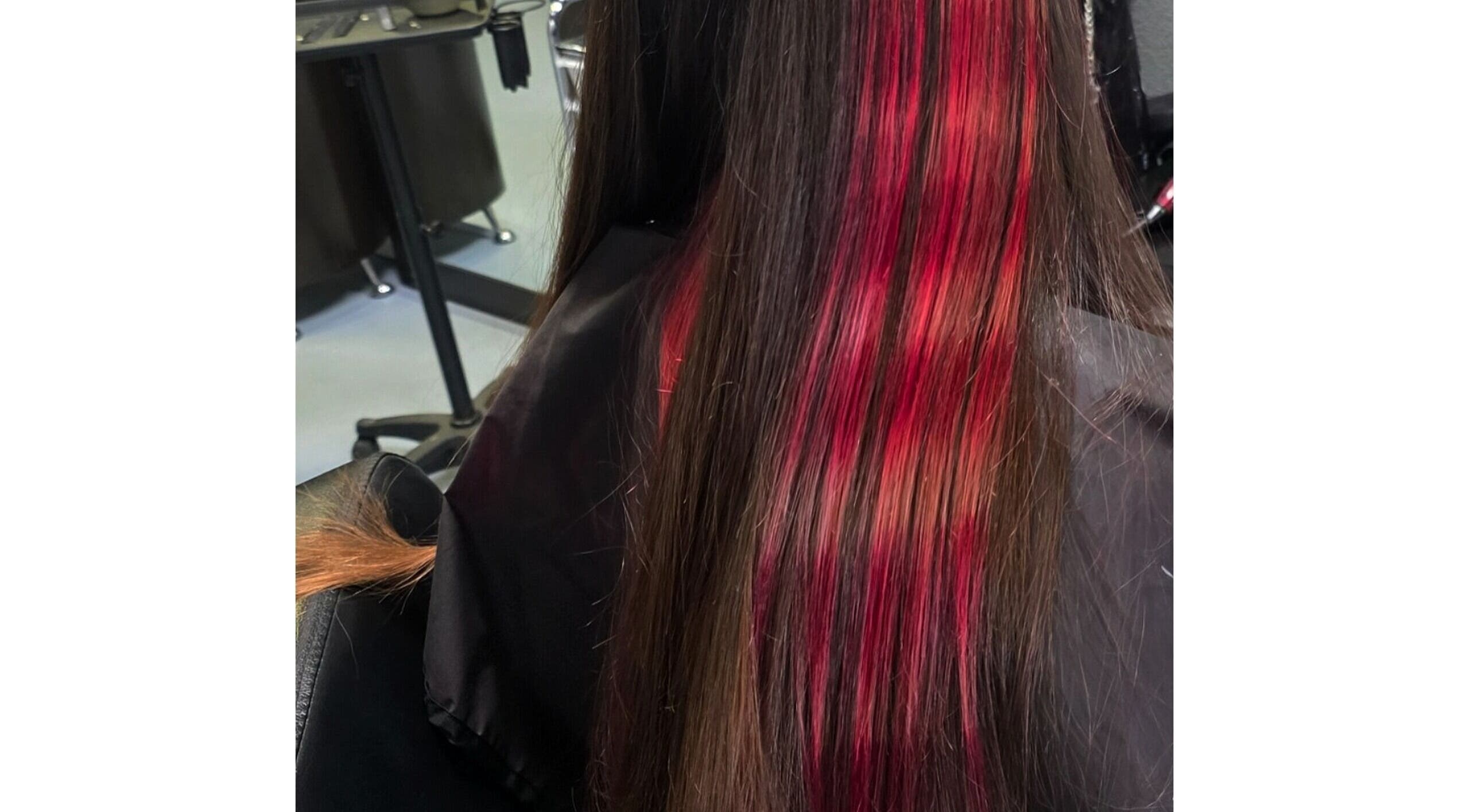Red-highlighted long hair styled at Shae Shears, Murrieta, California, US salon.
