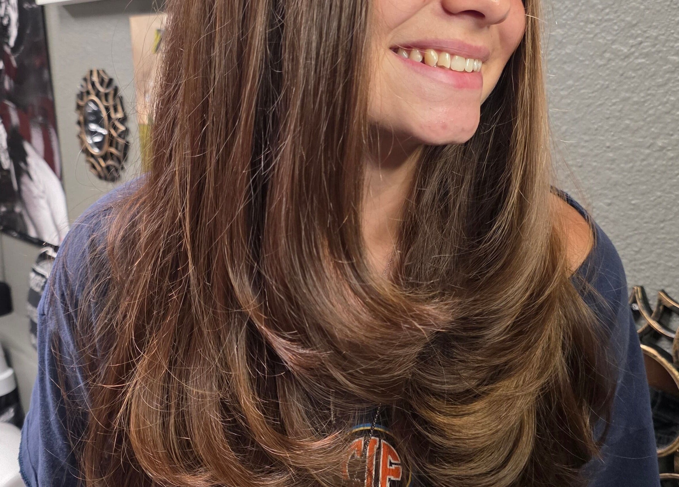 Woman with layered hairstyle smiling at Shae Shears, Murrieta, California, US.