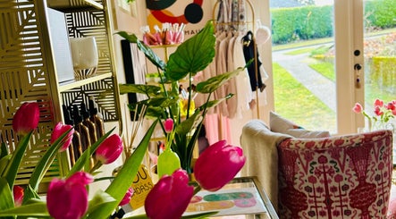 Vibrant tulips and decor at Physiques Boutique in Seattle, Washington, US, creating a serene and stylish ambiance.
