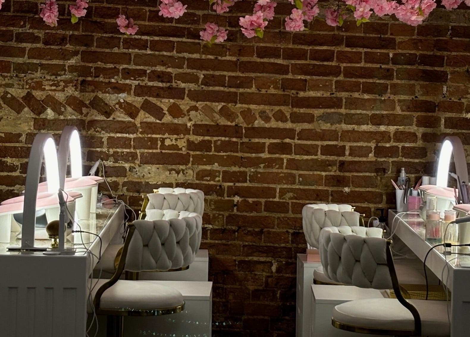 Elegant beauty stations at The Blossom Clinic, Beccles, England, GB, with floral decor and ambient lighting.